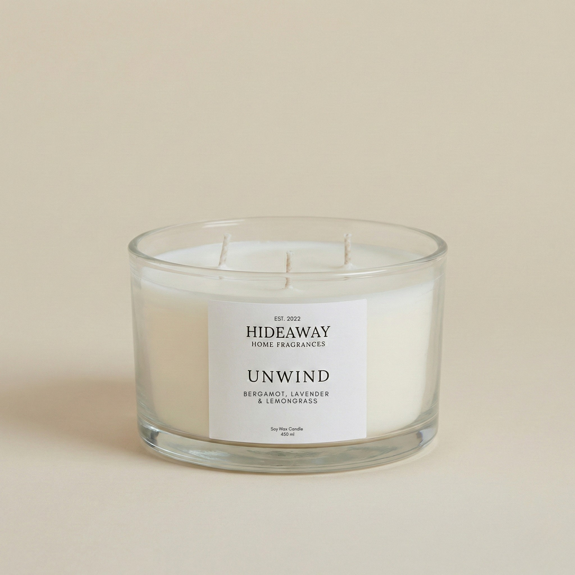 Unwind 3-wick luxury candle with lemongrass, bergamot and lavender creating a serene and restorative home atmosphere