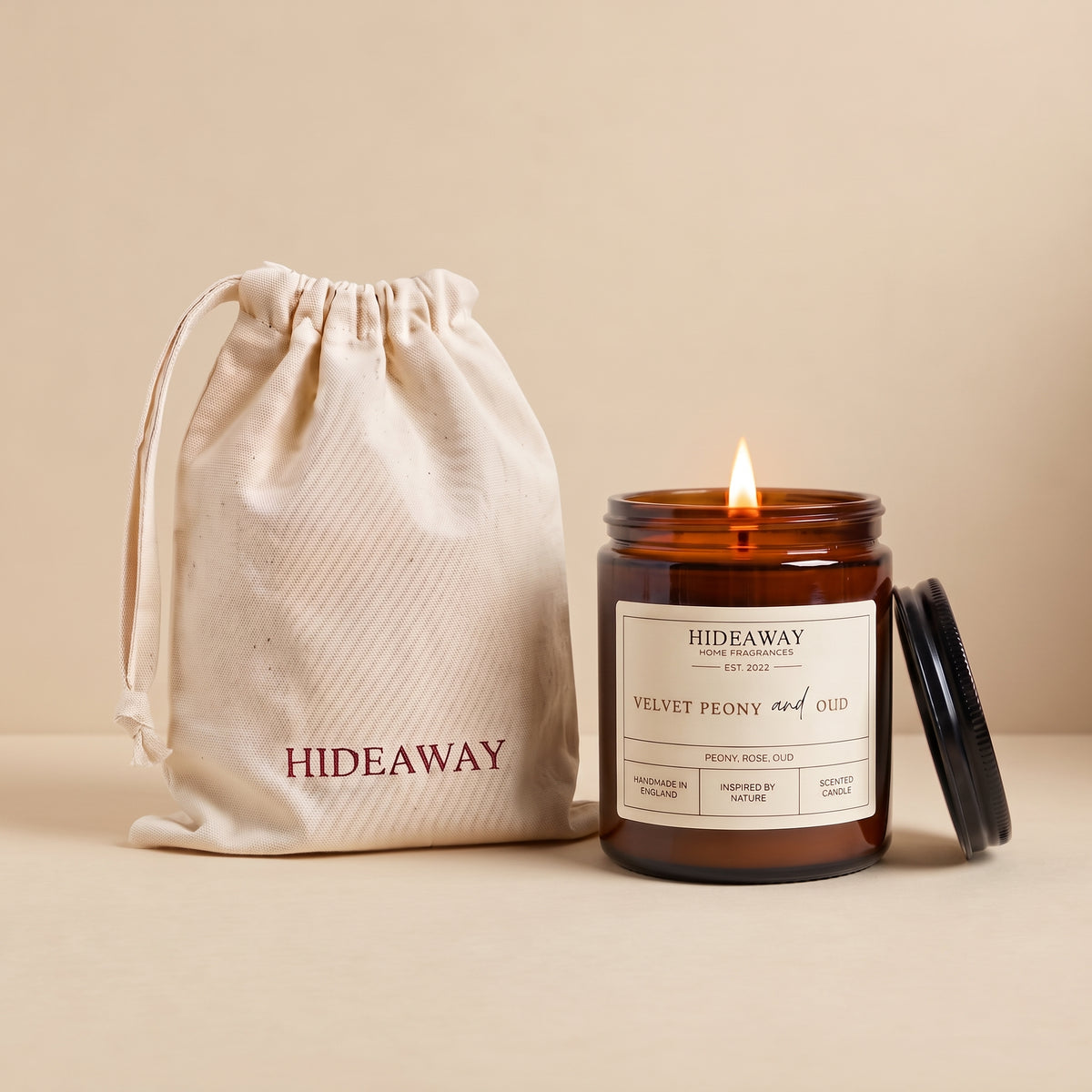Velvet peony and oud amber glass candle with rich floral woody scent by Hideaway Home Fragrances