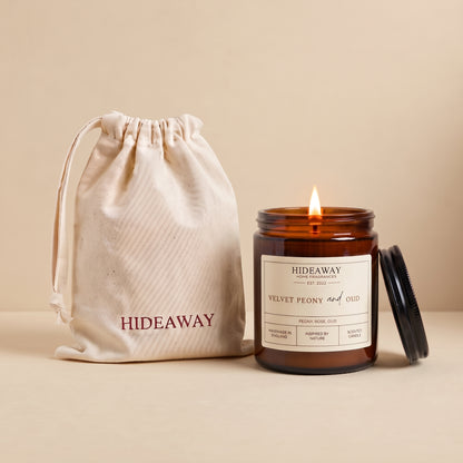 Velvet peony and oud amber glass candle with rich floral woody scent by Hideaway Home Fragrances