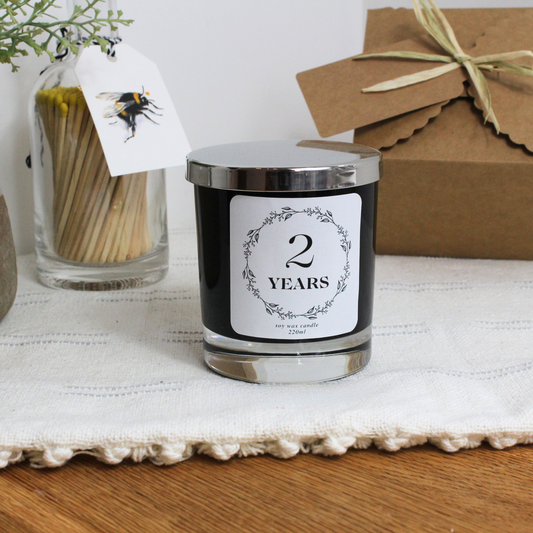 Personalised anniversary candle with floral wreath design and custom year – Hideaway Home Fragrance