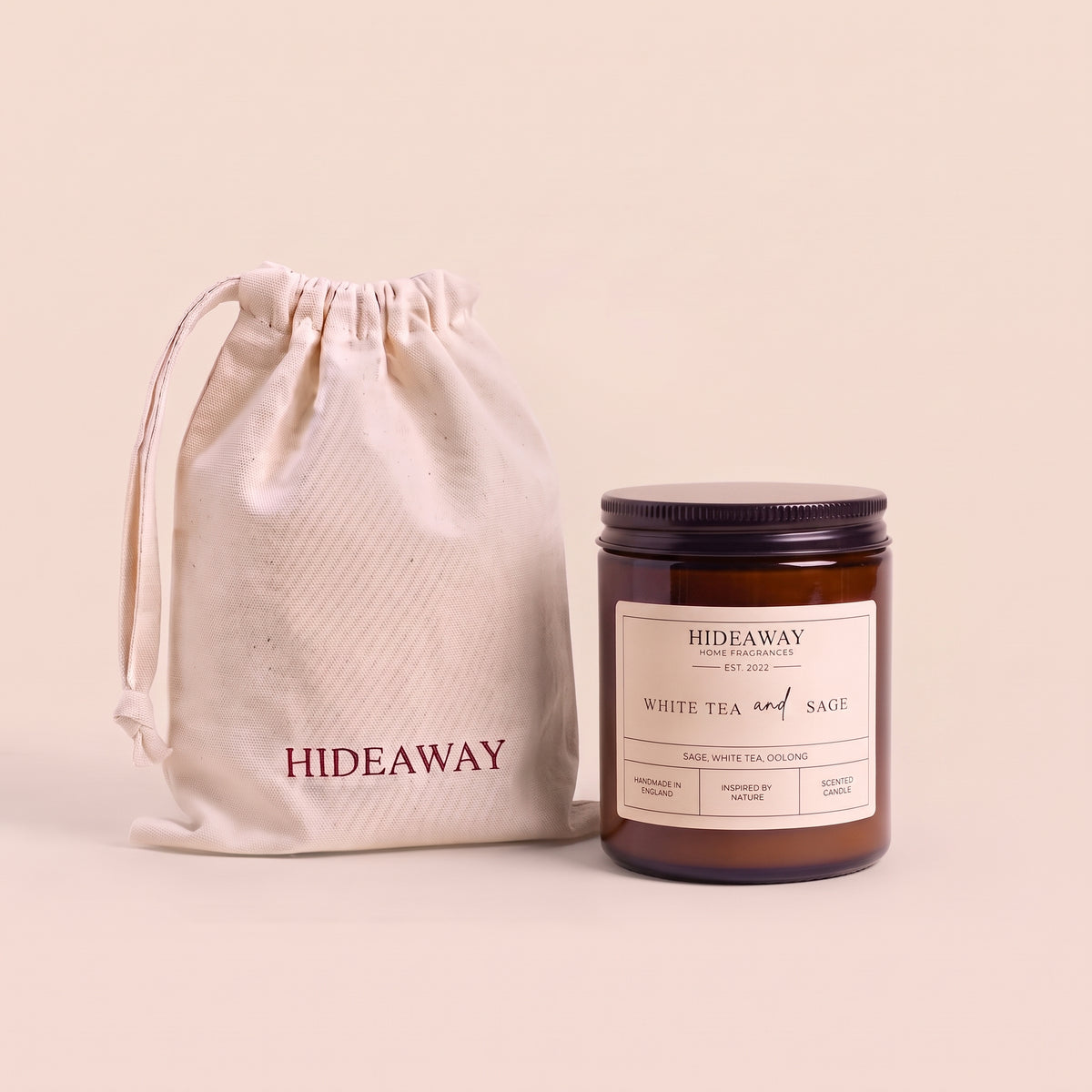 Tranquil white tea and sage aromatic candle in an amber glass jar creating a spa-like relaxation atmosphere from Hideaway Home Fragrances