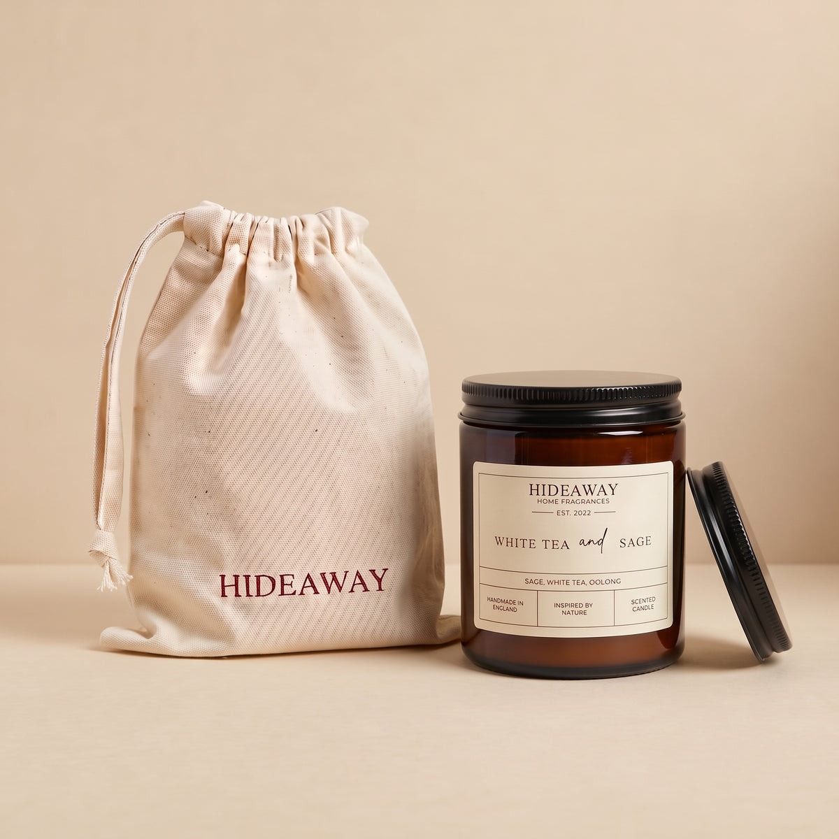 Tranquil white tea and sage aromatic candle in an amber glass jar creating a spa-like relaxation atmosphere from Hideaway Home Fragrances