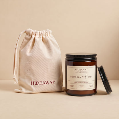 Tranquil white tea and sage aromatic candle in an amber glass jar creating a spa-like relaxation atmosphere from Hideaway Home Fragrances