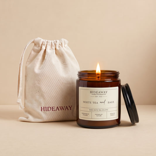 White tea and sage amber glass candle with fresh soothing herbal scent by Hideaway Home Fragrances