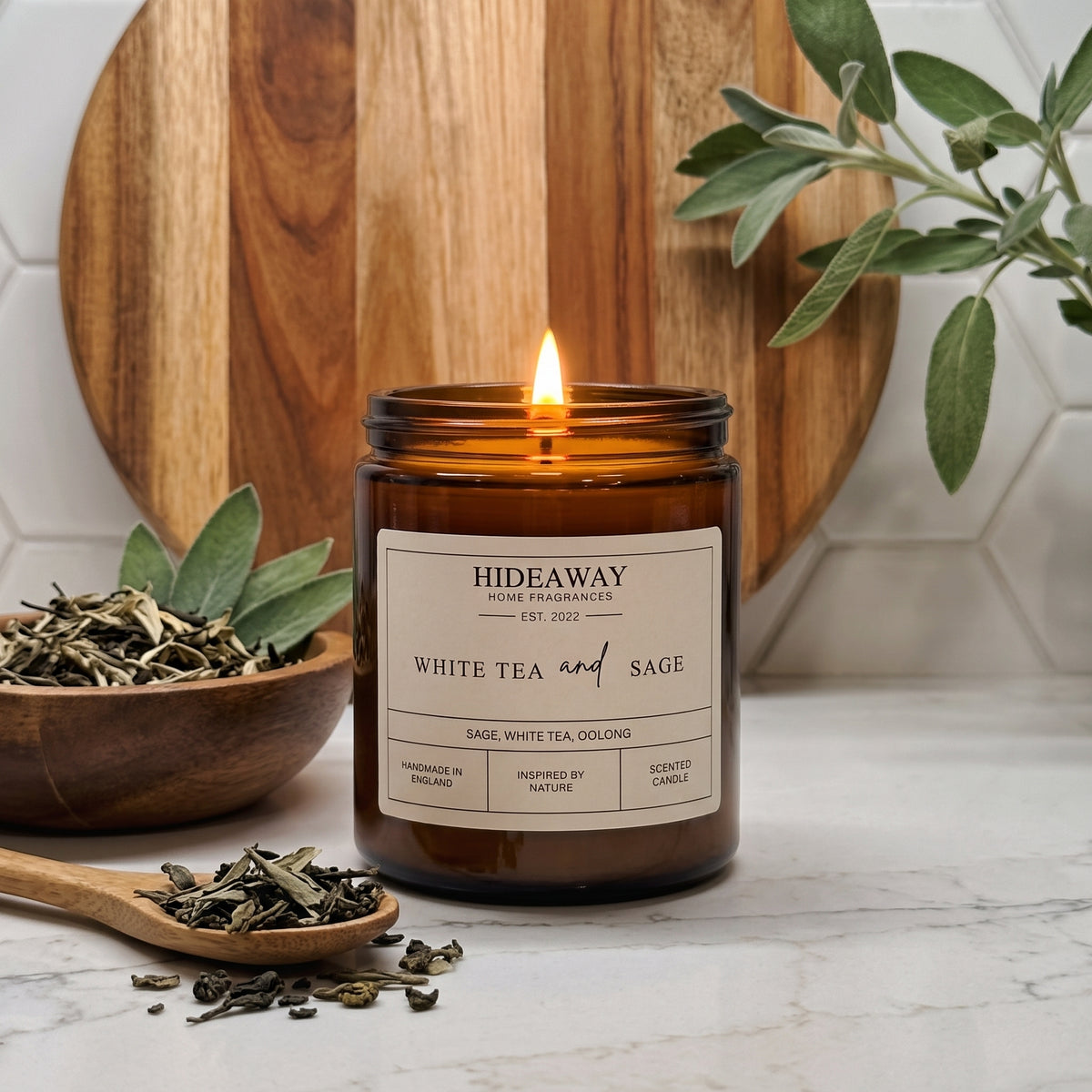 Calming white tea and sage amber glass jar candle styled in a minimalist sunlit bedroom, Hideaway Home Fragrances