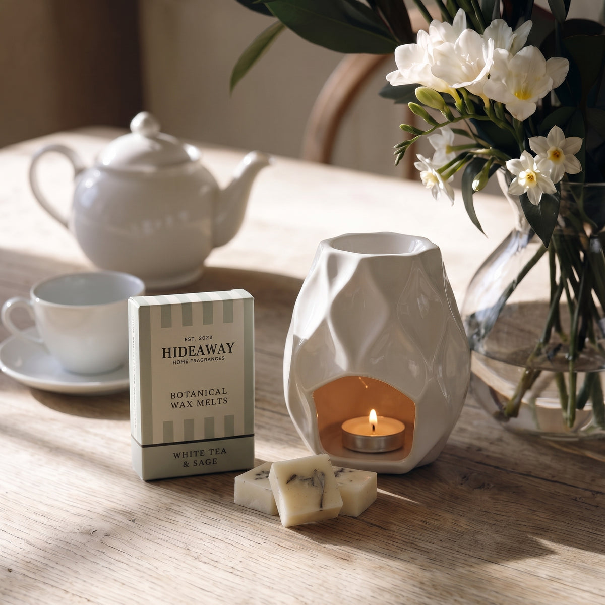 Artisan white tea and sage botanical wax melt snap bar by Hideaway Home Fragrances topped with dried herbal botanicals
