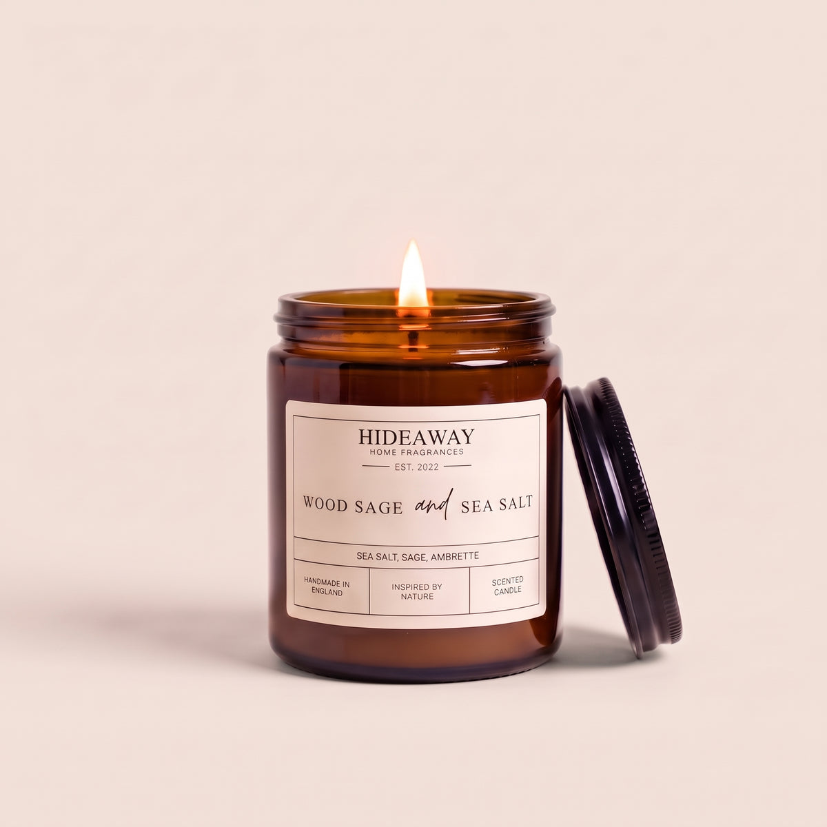 Hand-poured wood sage and sea salt amber glass candle featuring notes of earthy sage, mineral sea salt, and woody driftwood, Hideaway Home Fragrances