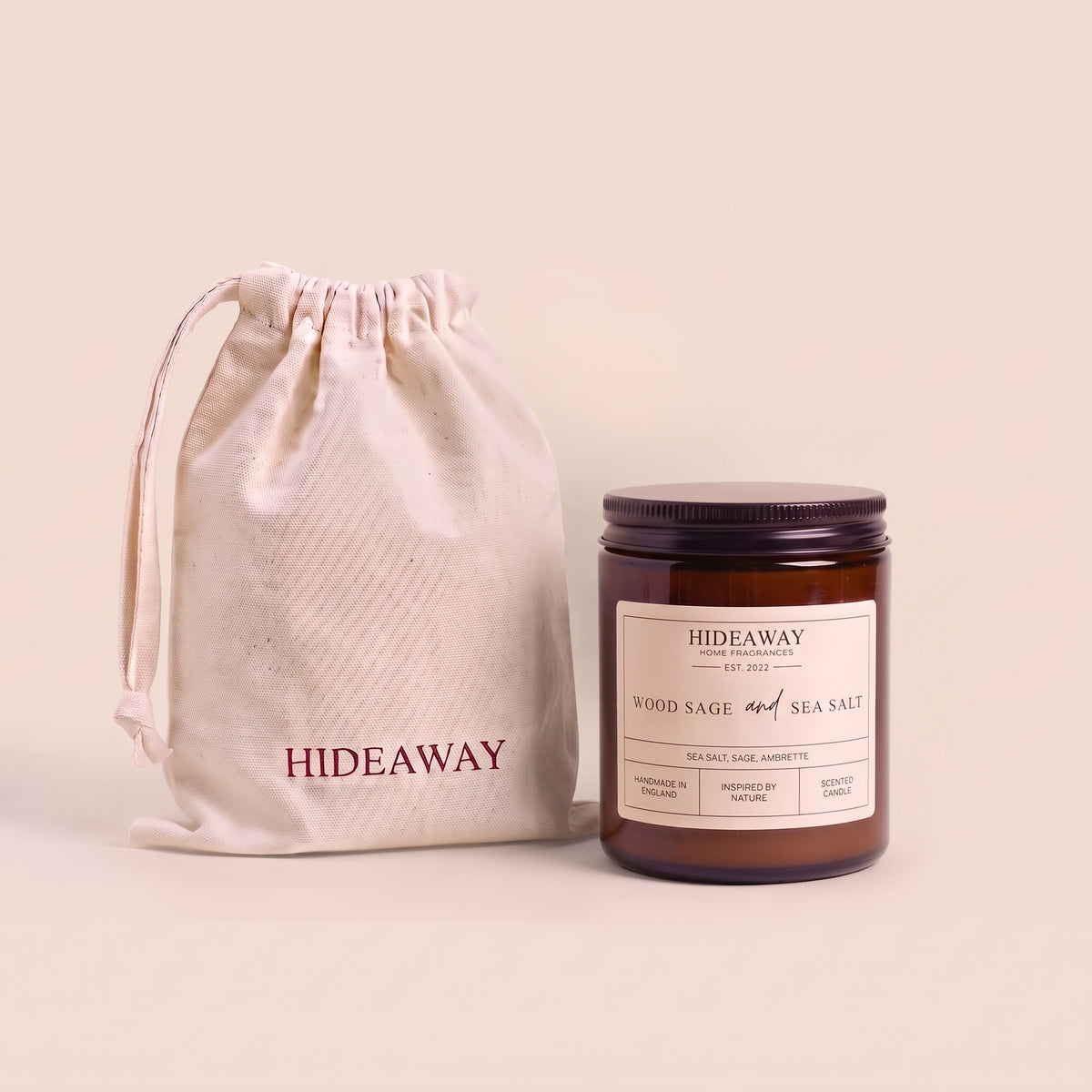 Breezy wood sage and sea salt aromatic candle in an amber glass jar creating a fresh ocean atmosphere from Hideaway Home Fragrances