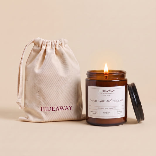 Wood sage and sea salt amber glass candle with fresh coastal woody scent by Hideaway Home Fragrances