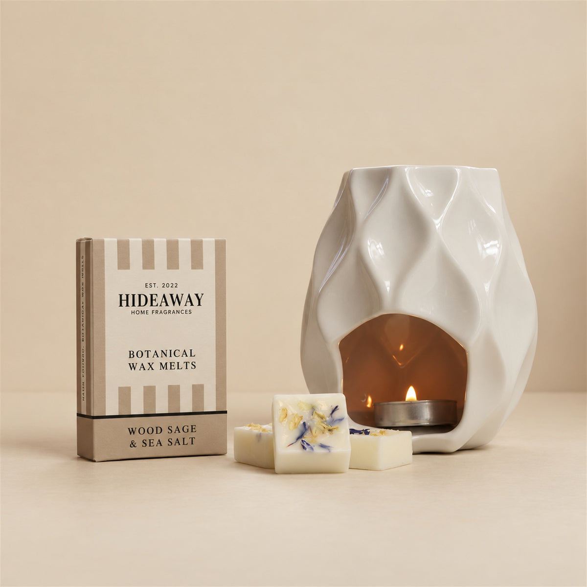 Hideaway Home Fragrances wood sage and sea salt botanical wax melts eco-friendly packaging highlighting notes of ambrette seeds, grapefruit, and ambergris