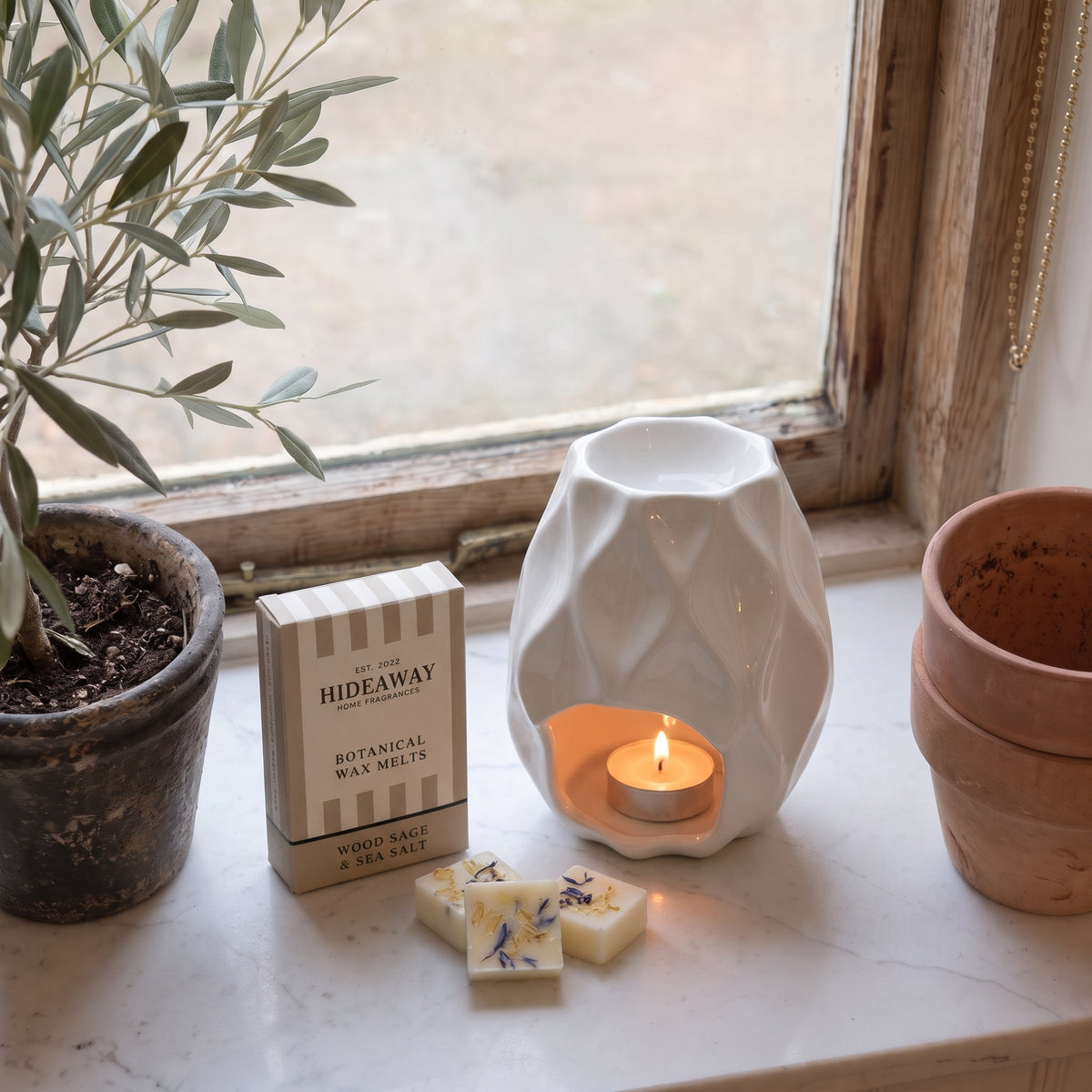 Artisan wood sage and sea salt botanical wax melt snap bar by Hideaway Home Fragrances garnished with dried coastal botanicals