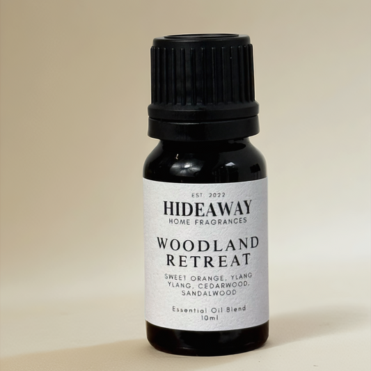 Essential oil with uplifting sweet orange, floral ylang ylang, and grounding cedarwood and sandalwood for a calming woodland-inspired scent — Hideaway Home Fragrances