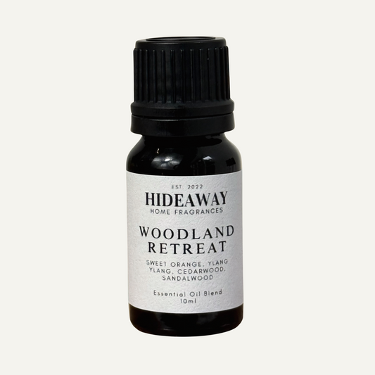 Essential oil with uplifting sweet orange, floral ylang ylang, and grounding cedarwood and sandalwood for a calming woodland-inspired scent — Hideaway Home Fragrances