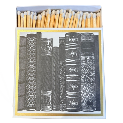 Luxury candle matchbox with illustrated books and gold foil detailing