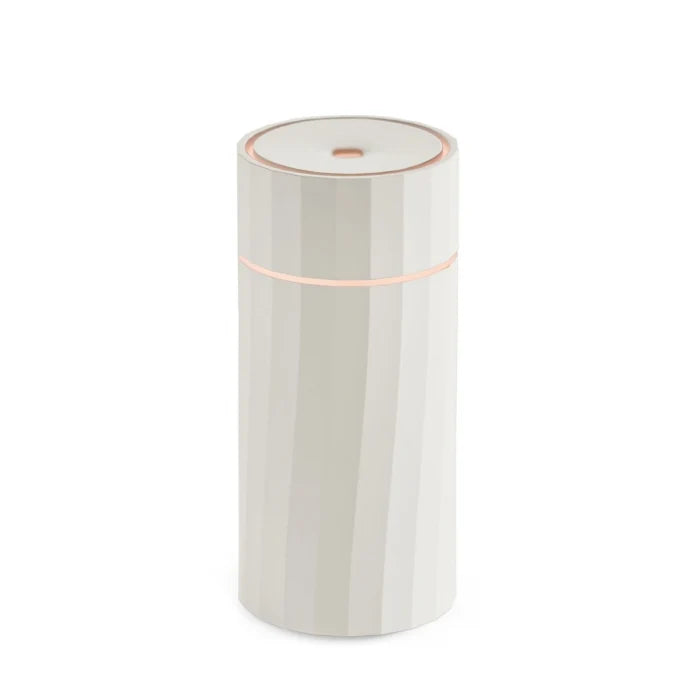 Detailed close-up of one-touch button interface and minimalist matte casing on the Nomad aroma diffuser from Hideaway Home Fragrances