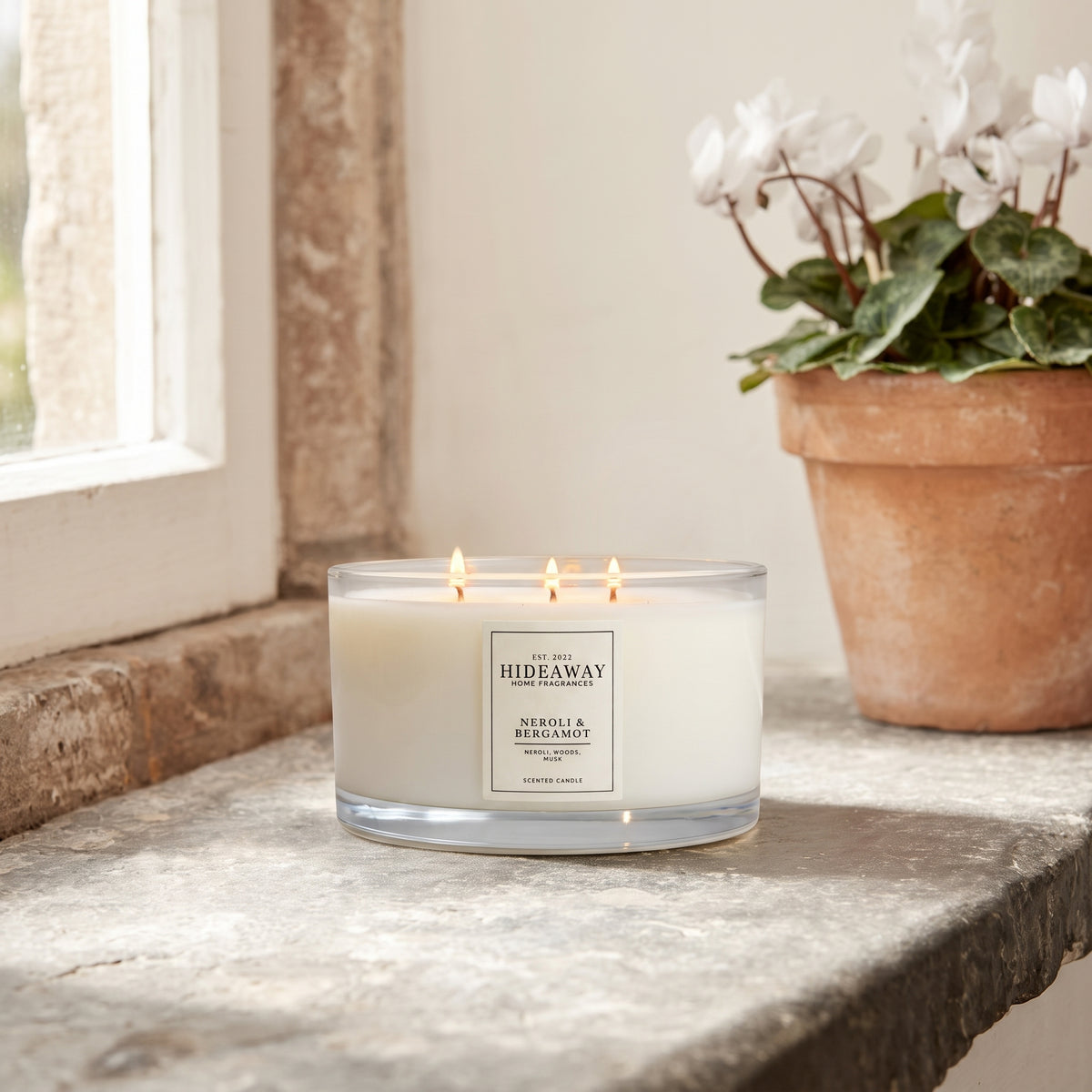 Neroli and Bergamot 3-wick luxury candle with zesty citrus fragrance creating an uplifting and energising home atmosphere