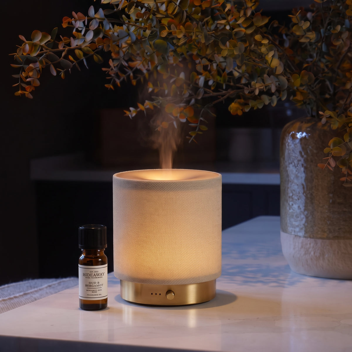 Fragrance notes breakdown for Hideaway Home Fragrances oud and bergamot fragrance oil featuring crisp bergamot, smoky oud, soft spices, and golden amber.