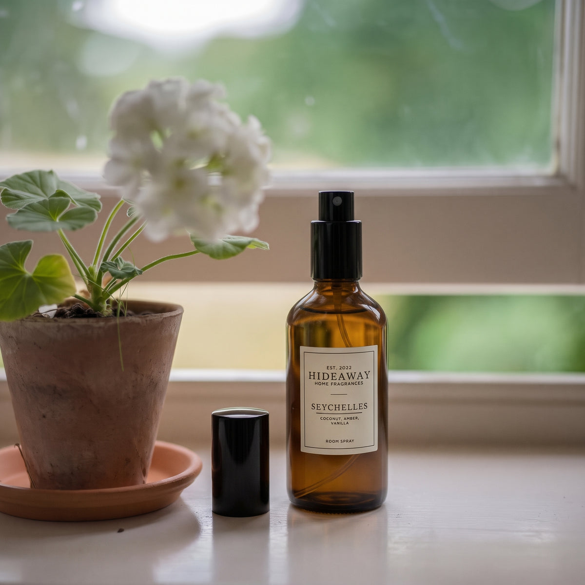 Scent notes breakdown for Hideaway Home Fragrances seychelles room spray highlighting tropical coconut, crisp bergamot, golden amber, and creamy vanilla.