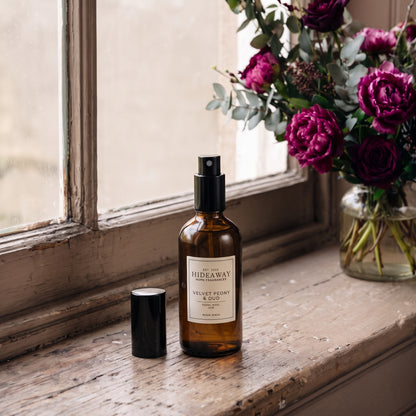 Fragrance notes breakdown for Hideaway Home Fragrances velvet peony and oud room spray featuring Taif rose, blooming peony, rich agarwood, and sweet praline.